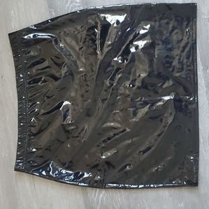 Black form fitting glossy midi skirt with stretch size 10